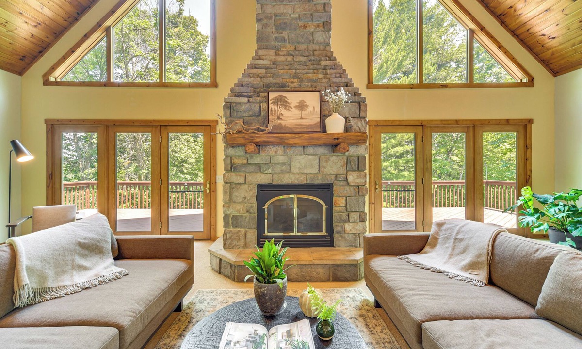 Amery House | New Listing! Timber Ridge Lake House is a private home in Amery Wisconsin on Lake Wapogasset/Bear Trap. The updated home balances the warmth of a large A-Frame with modern decor and finishes providing a serene stay with woods and lake views.