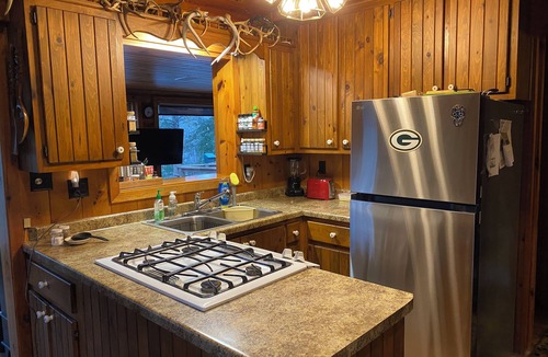 Suring Cabin | 20 acre, 5-bedroom waterfront cabin in Suring. Private pond & River Access!