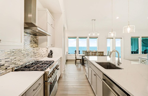 Rockport House | Bayfront water-view home with outdoor pool, lovely patio, hammock, fishing dock