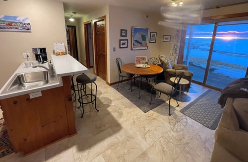Sister Bay Condo | Cozy Sister Bay Waterfront! Ground level porch, lawn, pier, bay, garage parking