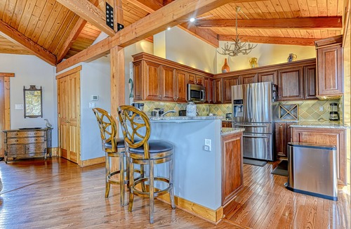 Louisa House | Huge lakefront home with A/C, sunroom, WIFI,game room, deck, & kayaks