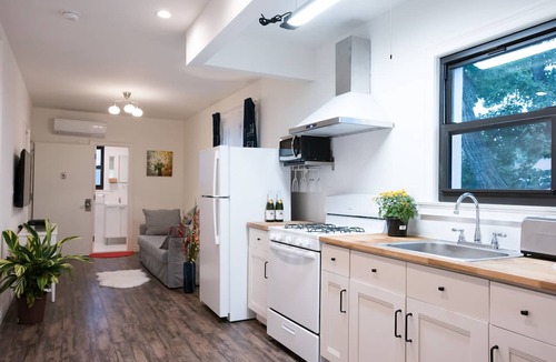 East Flushing Apartment | NEW! Luxury 4BD/4BA w/Rooftop Terrace & Outdoor Patio Kitchen