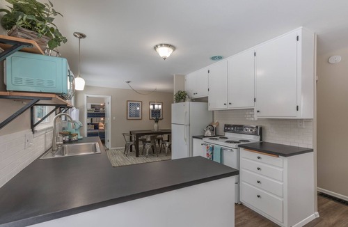 Moran Prairie House | South Hill's The Blue Bungalow l Mid-Century l Private Yard l EV Charger