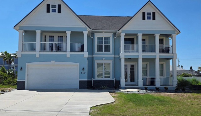 Beautiful two-story single family beach home with a private pool and ocean views in Ormond Beach