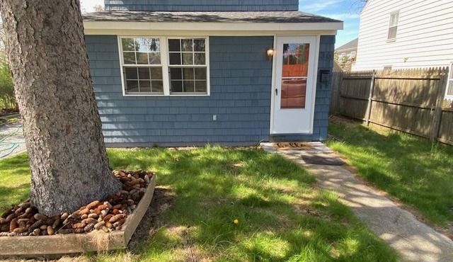 Charming Riverhead home with large outdoor patio & backyard firepit in Riverhead