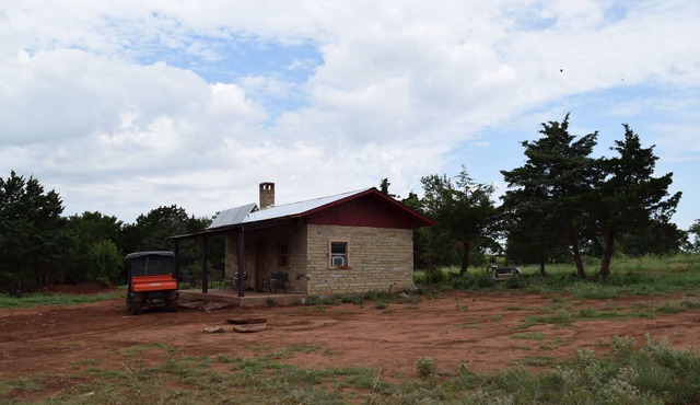 Off Grid experimental Rock-foam board-rock cabin in Mulhall