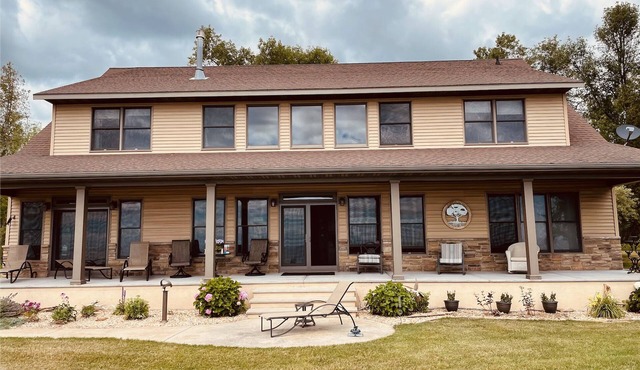Private lakefront home with 1,200 feet of sandy beach. A year-round retreat. in Cedar River