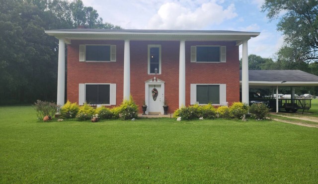 The Madison 2 story colonial style home built in 1978, with my father's own hand in Crossett
