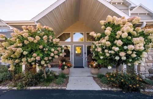 Sister Bay Condo | Cozy Sister Bay Waterfront! Ground level porch, lawn, pier, bay, garage parking