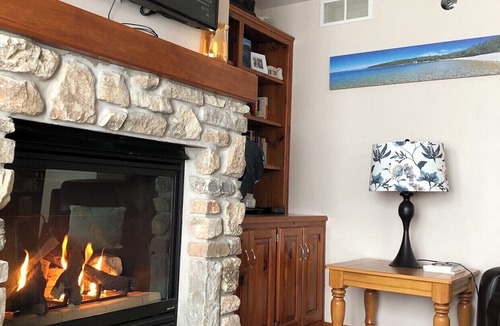 Sister Bay Condo | Cozy Sister Bay Waterfront! Ground level porch, lawn, pier, bay, garage parking
