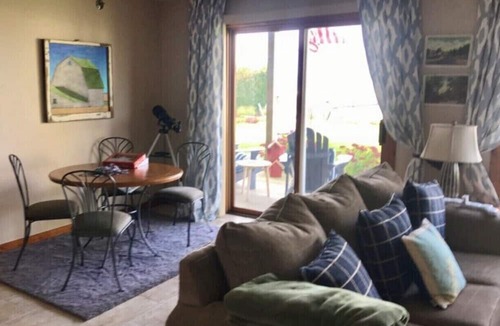 Sister Bay Condo | Cozy Sister Bay Waterfront! Ground level porch, lawn, pier, bay, garage parking