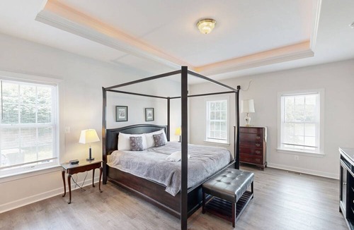 Orange House | Two-story, lakefront getaway with dock, beach, grill, 2 kayaks, 2 canoes, AC