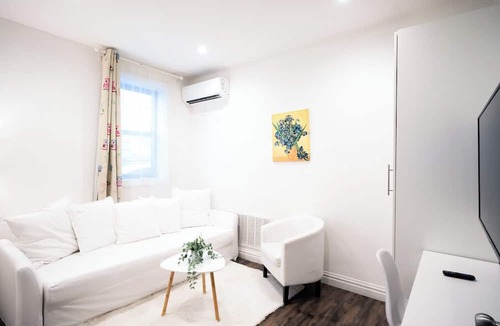 East Flushing House | Stylish 3-bedroom House with Skylight and Access to Rooftop Deck and Patio